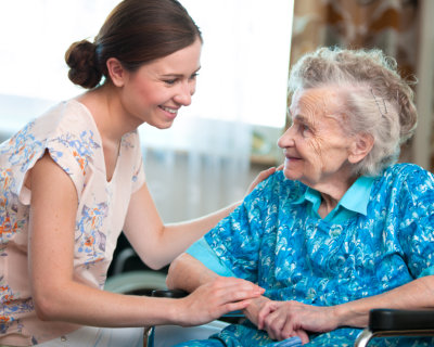 Senior woman with home caregiver