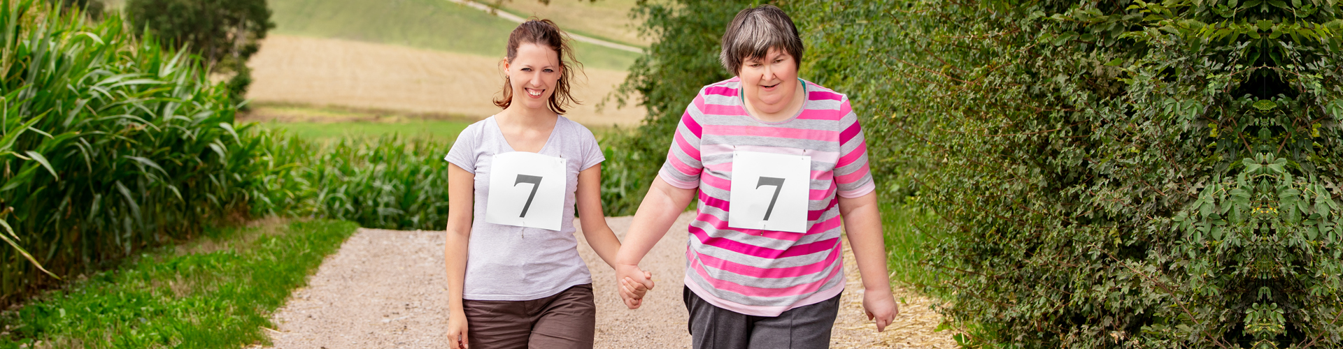 a caregiver and a disabled woman exercising